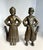 This charming pair of cast bronze and iron figural andirons dates to the late 19th to early 20th century, circa 1890–1920,...