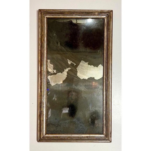 19th century Italian rectangular shaped mirror in a silver leaf finish with a antique mirror inset.