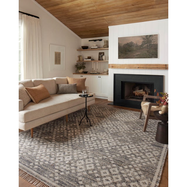 The Rivers Collection by Angela Rose x Loloi is a modern flatweave area rug with a reversible design featuring symmetrical...