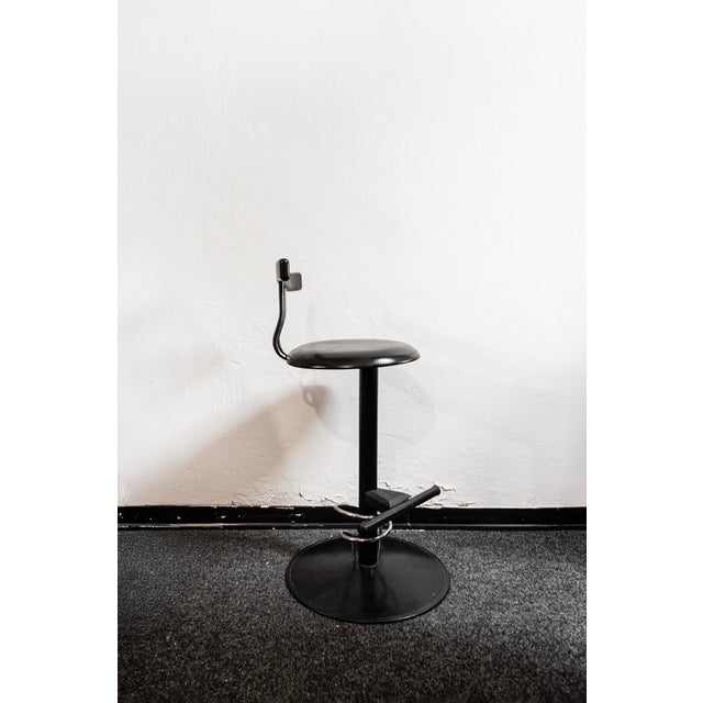 Bar stool with chromed and lacquered metal structure, seat and back in molded rubber, plastic details. Postmodern style....