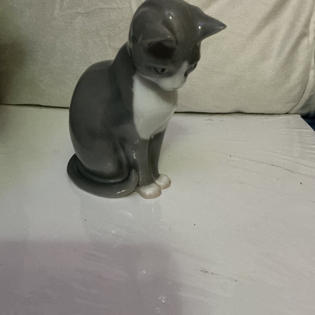 Beautiful Royal Copenhagen / Bing & Grøndahl porcelain cat figurine, model #1876, designed by Erik Nielsen. Features a...