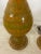 A pair of fantastic vintage MCM lava drip glaze lamps in orange and green. Includes harp and finials. Gold colored base...