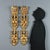 A pair of Mannerist-style pilaster strips in carved, painted, and gilded wood. The body is decorated with ribbons and...