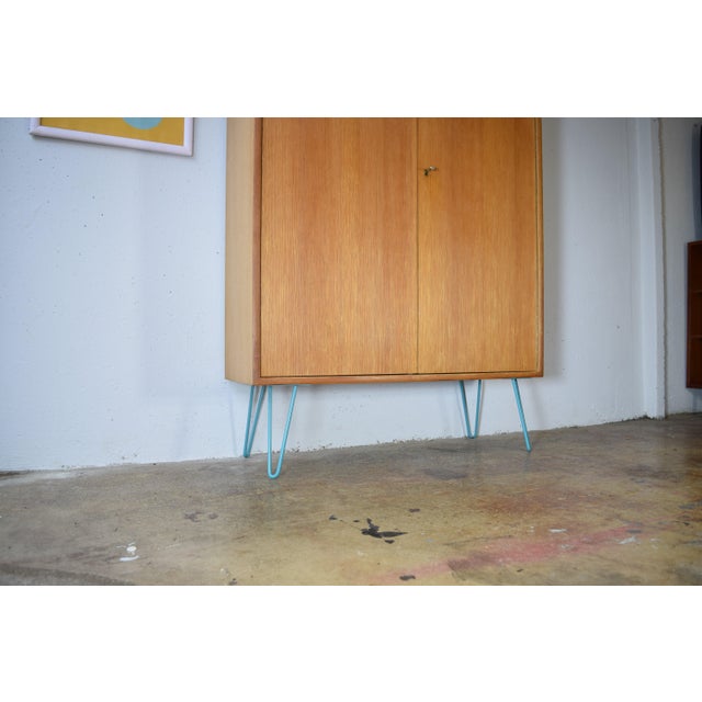 This is an elegant, multi-purpose cabinet from the 1960s by WK Möbel. The cabinet features a high-quality oak veneer....