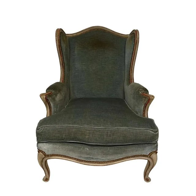 Beautiful and comfortable Louis XV "Bergère" armchair with light blue velvet upholstery and wood painted in beige colour...