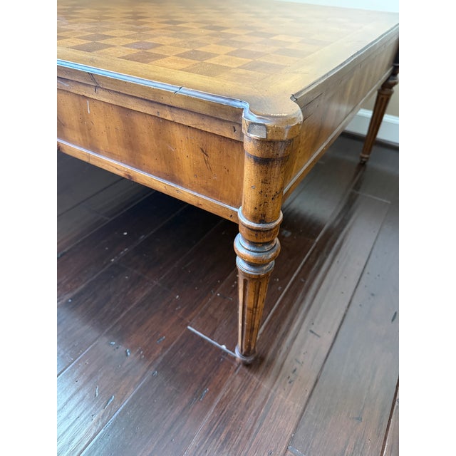 Elevate your living room or library with this classic French Neoclassical style square game coffee table. Featuring an...