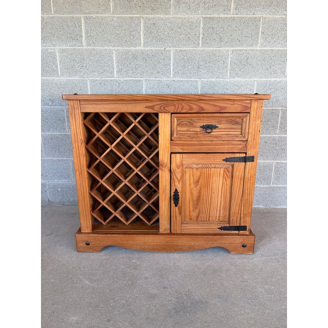 Description: Rustic Knotty Pine Drop Leaf Bar with Wine Rack. In Good Solid Condition Normal Vintage Furniture Age Wear,...