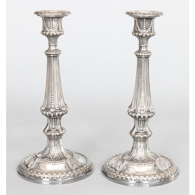 A beautiful pair of antique English silverplated candlesticks, circa 1900. Hallmarked on base. These gorgeous candle...