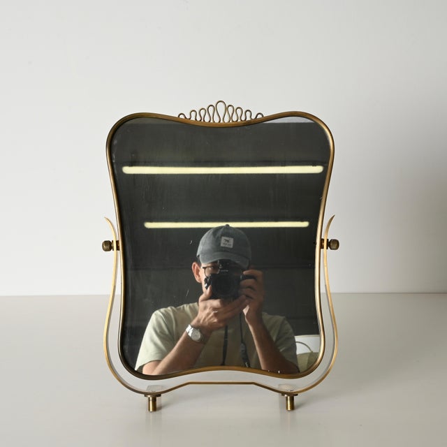 Outstanding adjustable table mirror, entirely crafted in solid brass. This incredibly stylish and unique piece was...