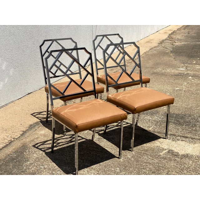 This set of four vintage chairs are collectors items. They are done in the style Milo Baughman. The frame of each chair is...
