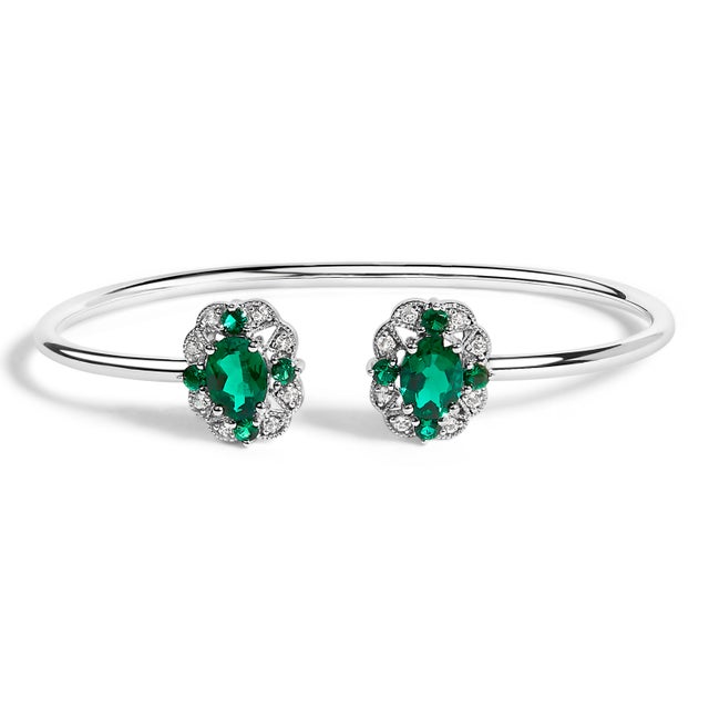 This exquisite .925 sterling silver bangle bracelet elegantly marries subtlety with splendor. In a celebration of nature's...