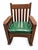 A handsome antique Mission oak rocking chair by The Harden Line of Camden, New York, dating to circa 1910. Richly figured...