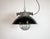 Industrial hanging lamp manufactured by Elektrosvit in former Czechoslovakia during the 1960s. It features a black enamel...