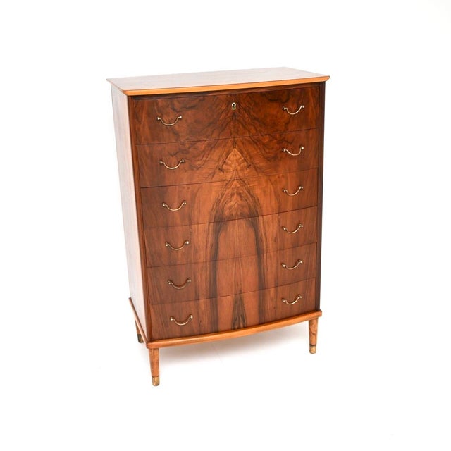A stunning Danish vintage walnut and brass chest of drawers. This was made in Denmark, it dates from the 1960’s. It is of...