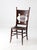 Antique Eastlake oak side chair dating to the late 19th century, featuring a sculptural back with turned spindles, carved...