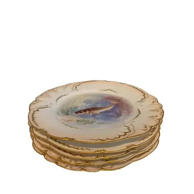 Delicate French platters have beautiful detailing of fish on the sides and on the interior of the dish, complete with a...