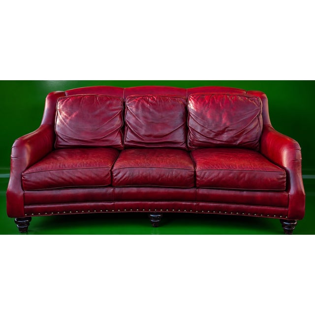 A substantial and exceptionally comfortable Hancock & Moore Sundance sofa, upholstered in rich burgundy leather with a...