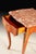 Handcrafted in Italy, this elegant accent table features a shaped marble top with warm natural tones and unique veining....