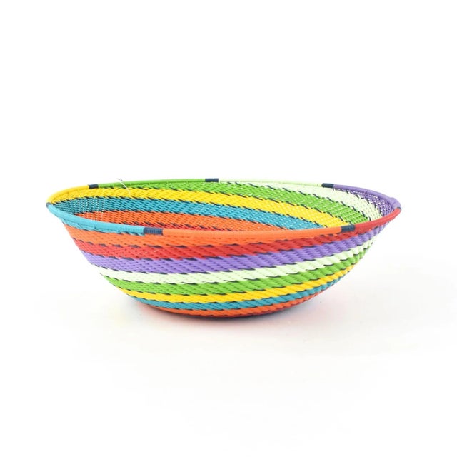 Zulu Telephone Wire Baskets from South Africa epitomize the fusion of traditional craftsmanship and contemporary...