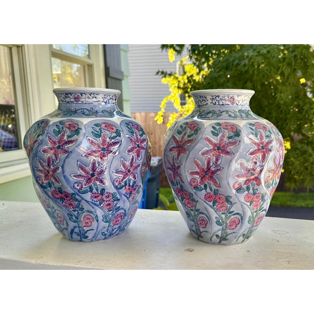 Vintage Chinese hand-painted vases, a pair. Elegant and mirror-matched, this pair of vintage ceramic vases features soft...