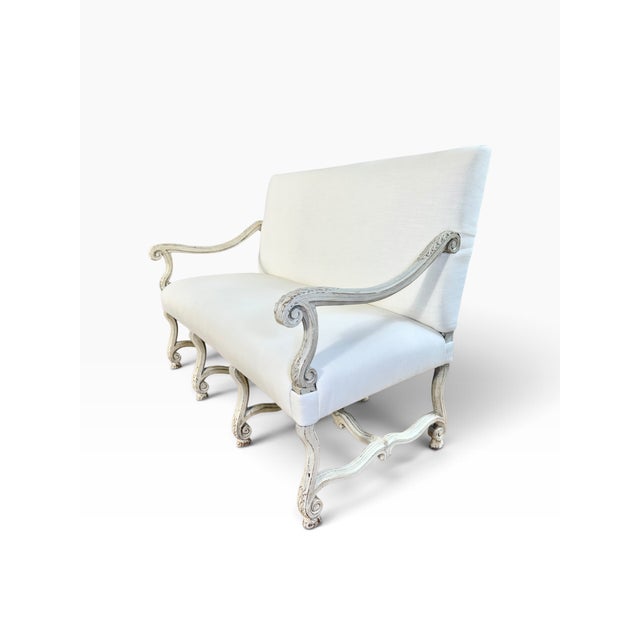 This is an exquisite French Louis XIII os de mouton style settee, circa early 1900s. Instantly recognizable by its solid...