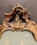 An exceptional and highly decorative Italian Rococo mirror featuring an elegant, dynamically sculpted design. This...