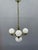 Original 1930s Art Deco chandelier from Czechoslovakia executed in solid brass with four opaline glass globes. The design...