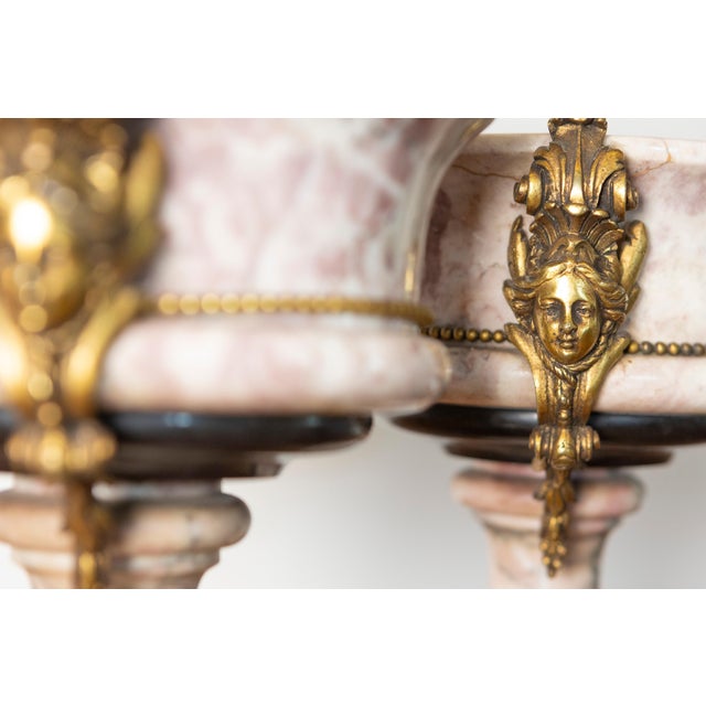 This exquisite pair of 19th-century French urns showcases the elegance and craftsmanship of the Neoclassical period,...