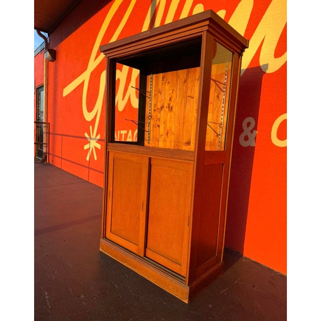 Antique Oak Mercantile Display Cabinet by Duluth. Upper section features two sliding glass doors, and glass sides,...