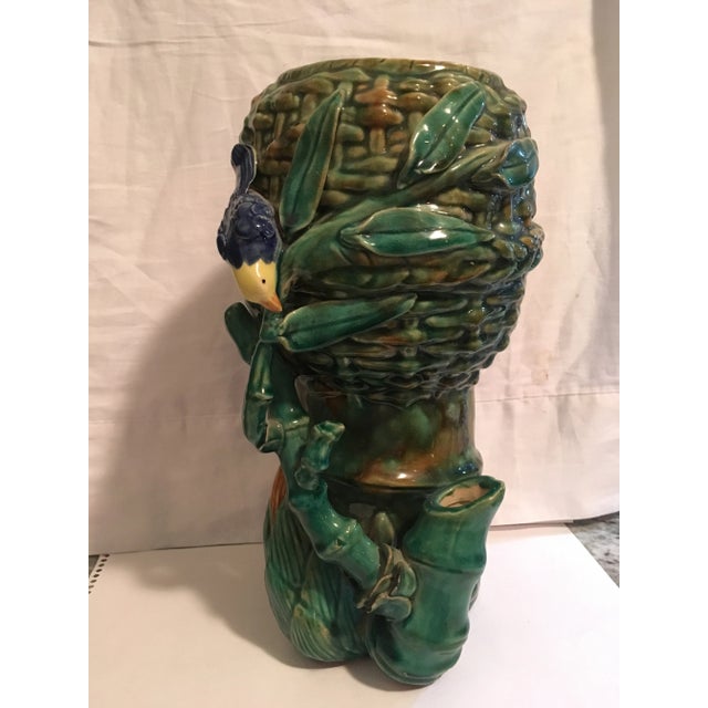 Large in scale, this beautifully detailed vase was used for a floral arrangement. The richness of the colors can stand...