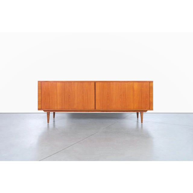 Danish modern teak tambour door credenza by Hornslet Mobelfabrik, Denmark, 1970s. Beautifully crafted from richly figured...