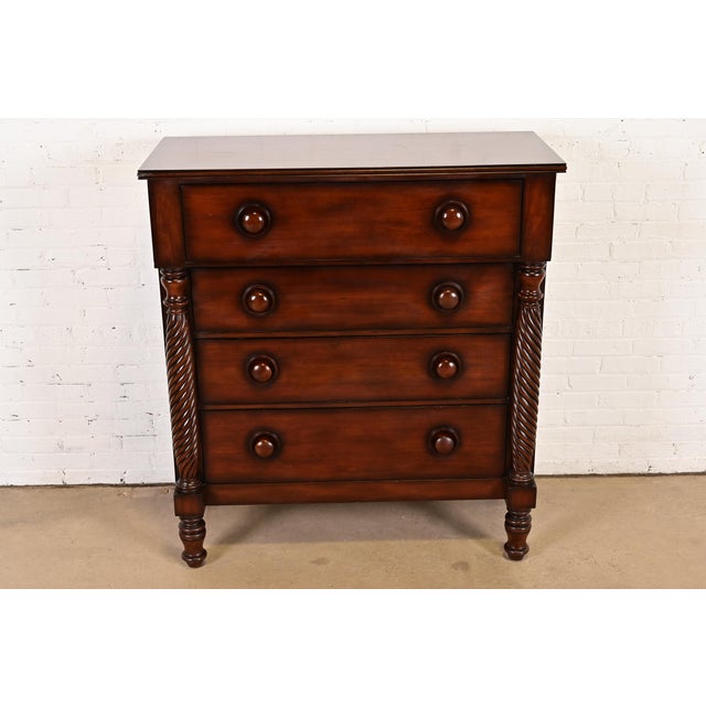 An exceptional American Empire style highboy dresser or chest of drawers By Ralph Lauren Colombia, Circa 1990s Mahogany,...