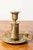 This 19th-century French candlestick is a stunning example of French craftsmanship, made of brass with intricate...
