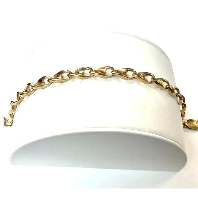 Heavy 14k yellow gold unisex link bracelet. 10" in length, 0.25"W, 29.33 grams TW. Lobster claw clasp. Marked 14K.