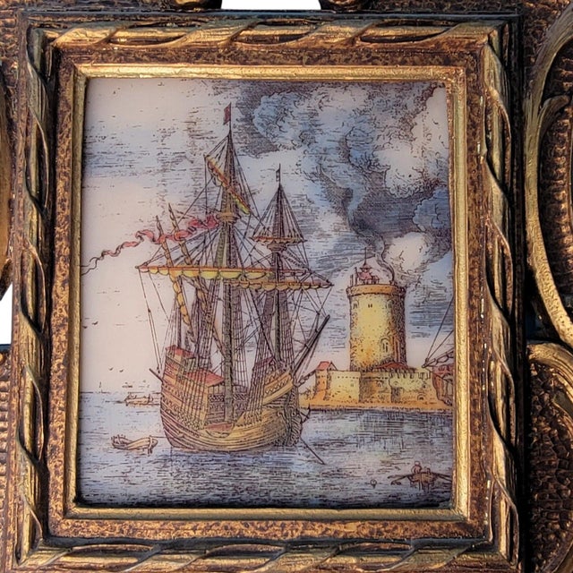 This vintage framed artwork showcases a depiction of a majestic "Man O' War" ship at sea. The intricate wood frame adds an...