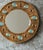 Round glazed ceramic wall mirror by the French ceramicist Francois Lembo, Vallauris, circa 1970s. The circular frame is...