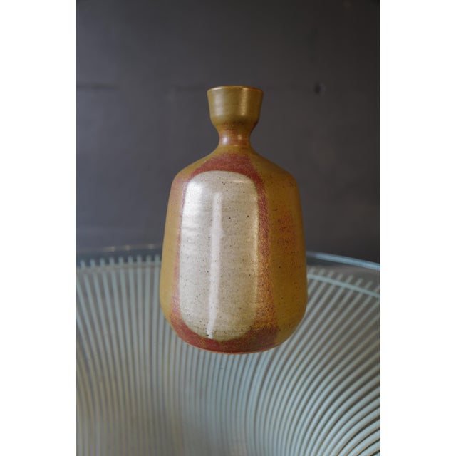 Indulge in the captivating beauty of this Japanese ceramic pottery vase, an exquisite masterpiece that effortlessly...