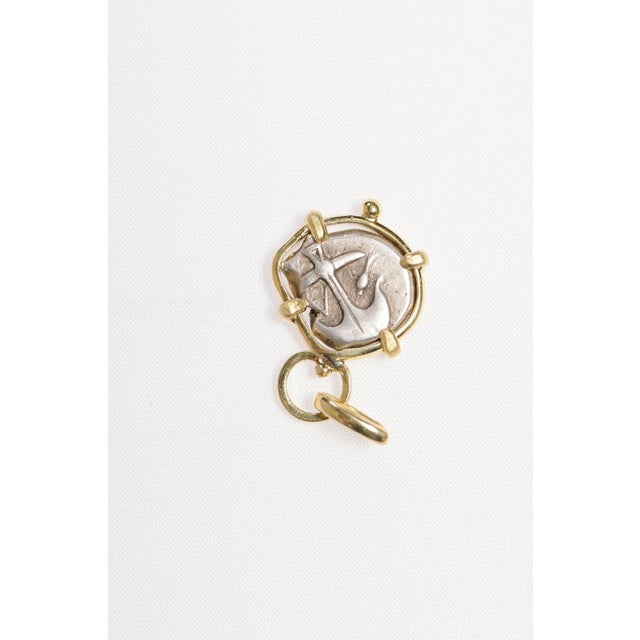 This is part of Chairish’s Fine Jewelry assortment. A Gorgon and Anchor silver drachm [coin] Pendant in 18kt gold. The...