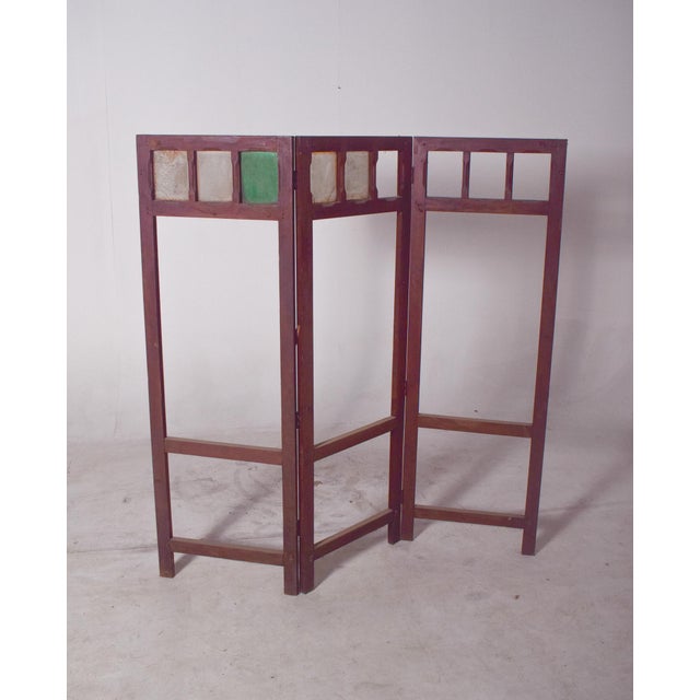 This Portuguese wooden folding screen features three hinged panels with an open-frame design, allowing flexibility for...