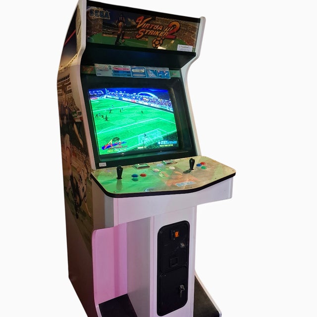 Produced in 1997 by the japanese company sega, the virtua striker 2 cabinet with this side image is very hard to find and...