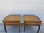 A pair of square walnut side tables by Henredon. The tables feature one drawer with beautiful brass pulls and banded tops....