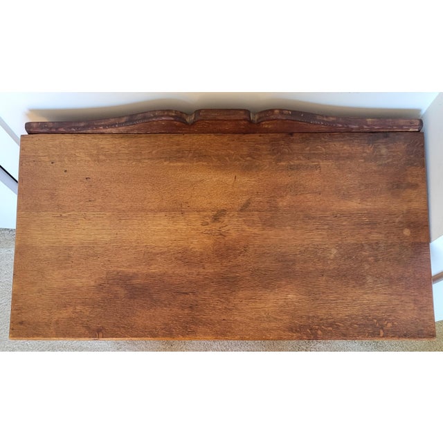 C. 1900 tiger oak washstand with 3 drawers and small cabinet with shelf. Cast metal drop pulls. Dimensions: 32 in wide x...