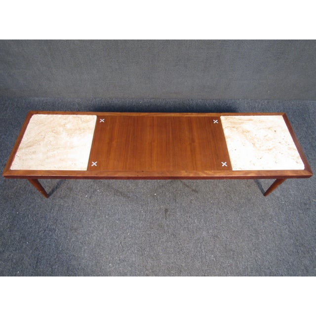 With rich teak woodgrain, eye-catching stone inlays, and an elegant Mid-Century design. Please confirm item location with...