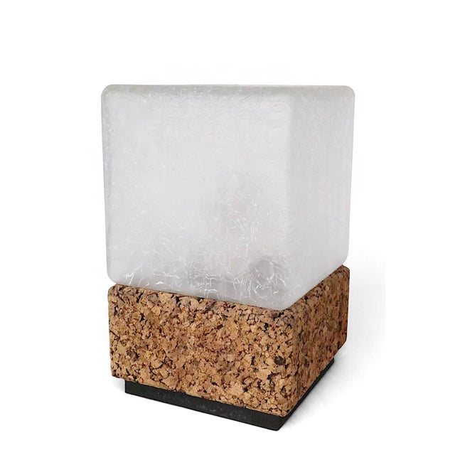 Unusual rectangular mid century table lamp, having a cork base with original crackle glass shade. The lamp is in...
