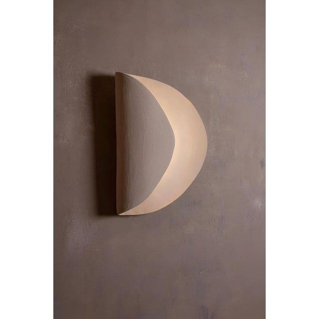 Onde #1 wall light in sandy stoneware by margaux leycuras. One of a kind, signed and numbered. Dimensions: d 13 x w 35 x h...