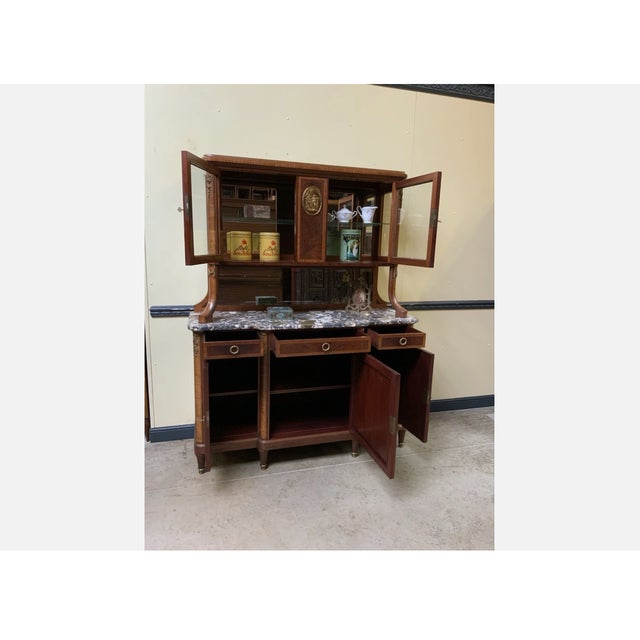 Age: circa 1910 Wood type: solid and veneered mahogany with inlays and high-quality burl wood panels Condition: very good,...