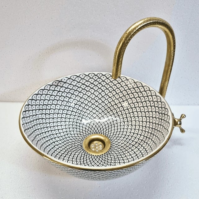 This white pottery sink bowl is truly a unique and stunning piece, perfect for adding a touch of luxury and style to your...