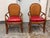 Design Plus Gallery presents a Pair of Rattan Armchairs from Palecek. The chairs have arched cane backs, tubular rattan...