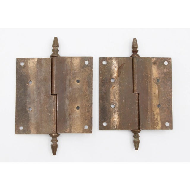 These right hand door hinges are made of solid bronze with steeple tips, lift off knuckles, and a template hole pattern....
