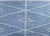 A wonderful late 20th century Indian hand-woven kilim rug with an indigo ground covered in white diagonal stripes in the...